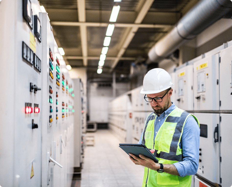 Technician with tablet in industrial setting