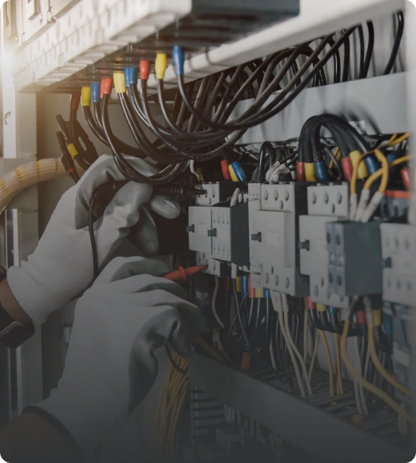 Technician adjusting electrical connections