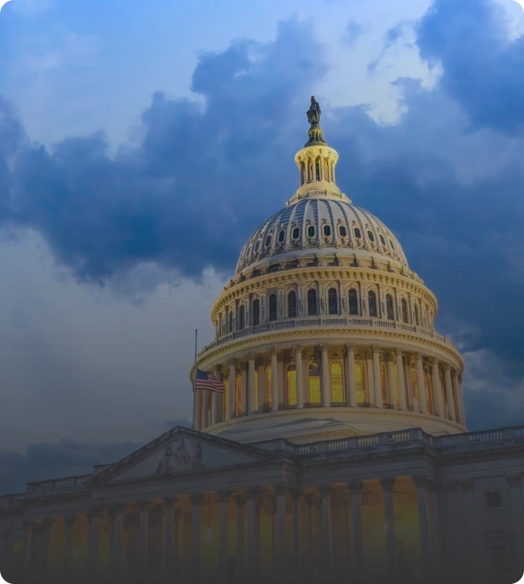 Capitol building under dramatic evening sky