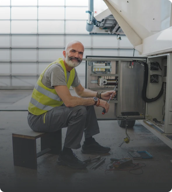 Technician working on electrical panel