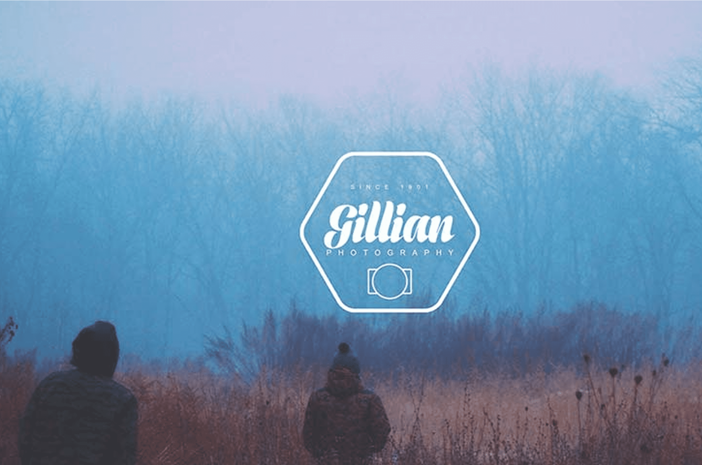 Two people walking in foggy field